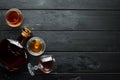 A glass of brandy on a black background. Top view. Royalty Free Stock Photo