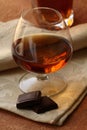 Glass of brandy and chocolate Royalty Free Stock Photo