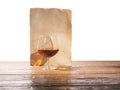 Glass of brandy, old paper on a white background Royalty Free Stock Photo