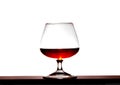 Glass with brandy on a white background Royalty Free Stock Photo