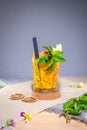 Glass of Brazilian passion fruit cocktail with fresh mint. Royalty Free Stock Photo