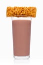 Glass of breakfast chocolate milk with cereal bar Royalty Free Stock Photo