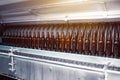 Glass brown beer bottles in industrial bottle washer. Glass brown beer.