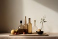 Glass brown bottles of different shapes, a brown bowl, apples and plums on a wooden kitchen board.