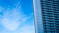 Glass building with balcony with blue sky background,Abstract part of modern architecture Royalty Free Stock Photo