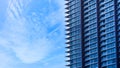 Glass building with balcony with blue sky background,Abstract part of modern architecture Royalty Free Stock Photo