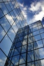 Glass Building for Business Reflection of Blue Sky and Clouds Royalty Free Stock Photo