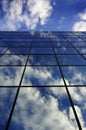 Glass Building for Business Reflection of Blue Sky and Clouds Royalty Free Stock Photo