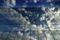 Glass Building for Business Reflection of Blue Sky and Clouds Royalty Free Stock Photo