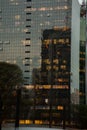 Glass building facade with building reflextions at night Royalty Free Stock Photo