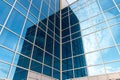 Glass building with mirrored windows. Skyscraper. Line pattern, perspective, steel structure, urban abstraction. Geometric shape, Royalty Free Stock Photo