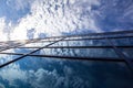 Glass building with reflections of blue sky and clouds Royalty Free Stock Photo