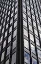 Glass building, skyscraper in midtown, in Manhattan with reflection and blue sky Royalty Free Stock Photo