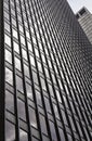 Glass building, skyscraper in midtown, in Manhattan with reflection and blue sky Royalty Free Stock Photo