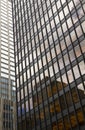 Glass building, skyscraper in midtown, in Manhattan with reflection and blue sky Royalty Free Stock Photo