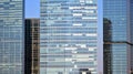 Glass building with transparent facade of the building and blue sky.