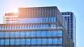 Glass building with transparent facade of the building and blue sky.