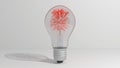 A glass bulb with a miniature tree inside. A tree with red leaves. 3D render Royalty Free Stock Photo