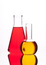 Glass bulbs with colored liquid (yellow, red) on a white background