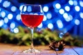 A glass of burgundy wine. Concept of Happy Christmas, New Year, Royalty Free Stock Photo