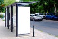 Bus shelter at a bus stop. empty white ad panel and billboard sign for mockup