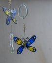 Glass butterflies dangle in a breeze