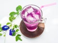 Glass of butterfly pea flower juice on white background Royalty Free Stock Photo