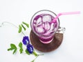 Glass of butterfly pea flower juice on white background Royalty Free Stock Photo