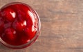 Glass Canning Jar Filled with Cherry Pie Filling on a Wooden Table Royalty Free Stock Photo