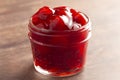 Glass Canning Jar Filled with Cherry Pie Filling on a Wooden Table Royalty Free Stock Photo