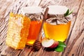 Glass cans full of honey and apple piece and combs. Royalty Free Stock Photo