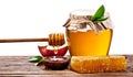 Glass cans full of honey, apples and honeycombs on wood. Clipping paths. Royalty Free Stock Photo