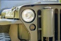 Glass car headlight and grille,  part of retro army jeep vehicle Royalty Free Stock Photo