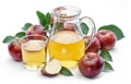 Glass and carafe of fresh apple juice and organic apples isolated on white background Royalty Free Stock Photo