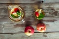 Glass and carafe of green tea with mint and apples Royalty Free Stock Photo