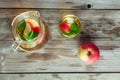 Glass and carafe of green tea with mint and apples Royalty Free Stock Photo