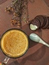 a glass of caramel coffee with biscuits and dry flower garnish Royalty Free Stock Photo