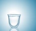 Glass with carbonated water on blue gradient background Royalty Free Stock Photo