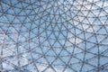 Glass ceiling in blue sky sunlight, abstract. Glass roof of the building. Geometrical ceiling, limpid round ceiling Royalty Free Stock Photo