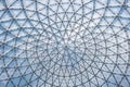 Glass ceiling in blue sky sunlight, abstract. Glass roof of the building. Geometrical ceiling, limpid round ceiling Royalty Free Stock Photo