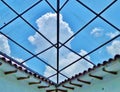 Glass Ceiling with Blue Sky and White Clouds Royalty Free Stock Photo