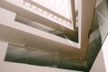 Glass ceiling inside the building. Floor balconies inside the building, glass ceiling and natural lighting. The geometry