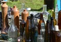 Glass and ceramic bottles of different colors.