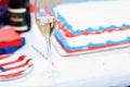 Glass of champagne against cake at party Royalty Free Stock Photo