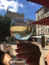 Champagne in a glass with reflection of historical buildings in Bourdas, France