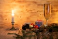 A glass of champagne.Bubbly. A goblet of Sparkling wine. A blur background. A wineglass of Fizz. Christmas. A candle Royalty Free Stock Photo