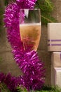 a glass of champagne and Christmas gifts Royalty Free Stock Photo