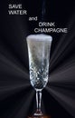 glass of champagne and the inscription save water and drink champagne