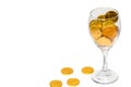 Glass of champagne with Overflowing golden coins