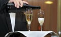 Glass of champagne served with the drink at a reception, close up view. Royalty Free Stock Photo